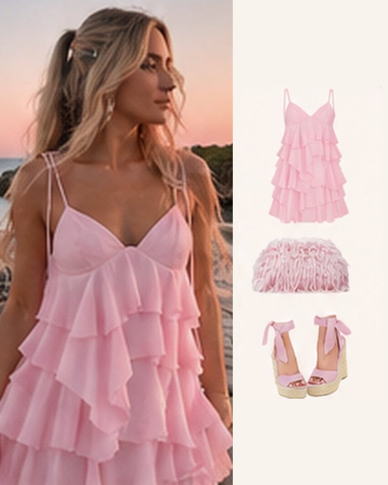Pink ruffle mini dress by the sea, with a fluffy pink bag and lace-up wedges.